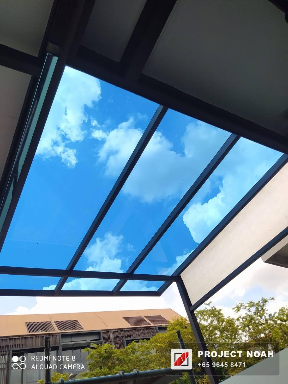 Glass skylight panels opening to clear sky