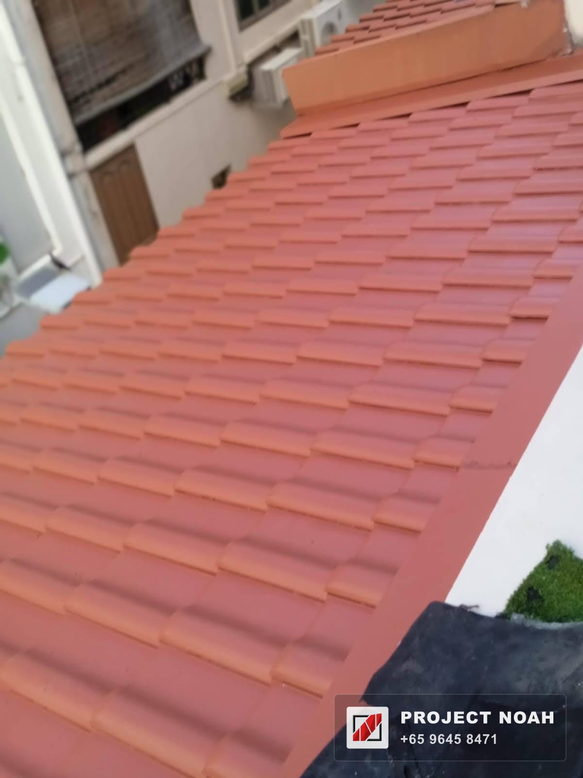 Metal roof tiles laid to a pitched roof