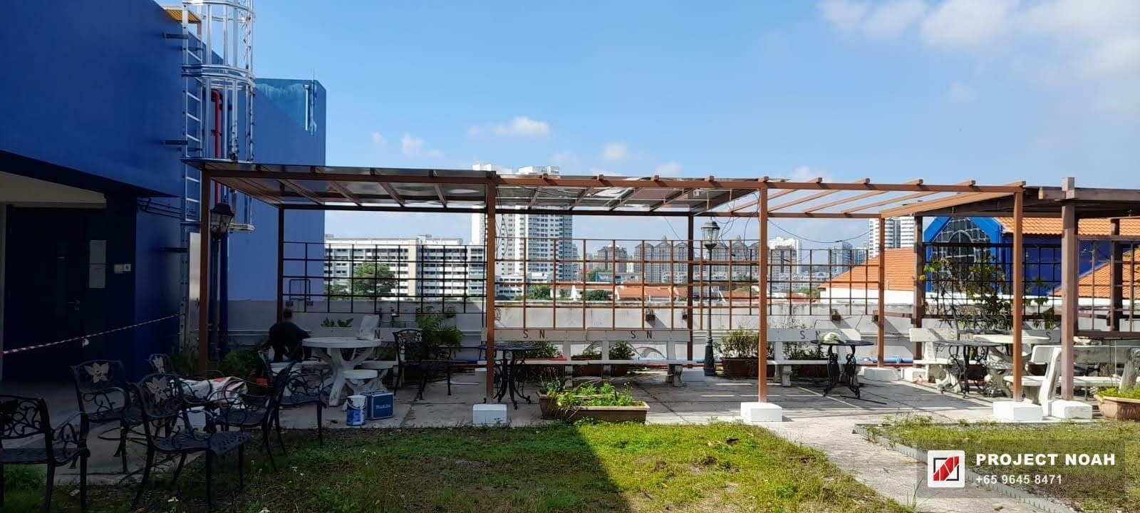 Pergola run along a rooftop garden walkway